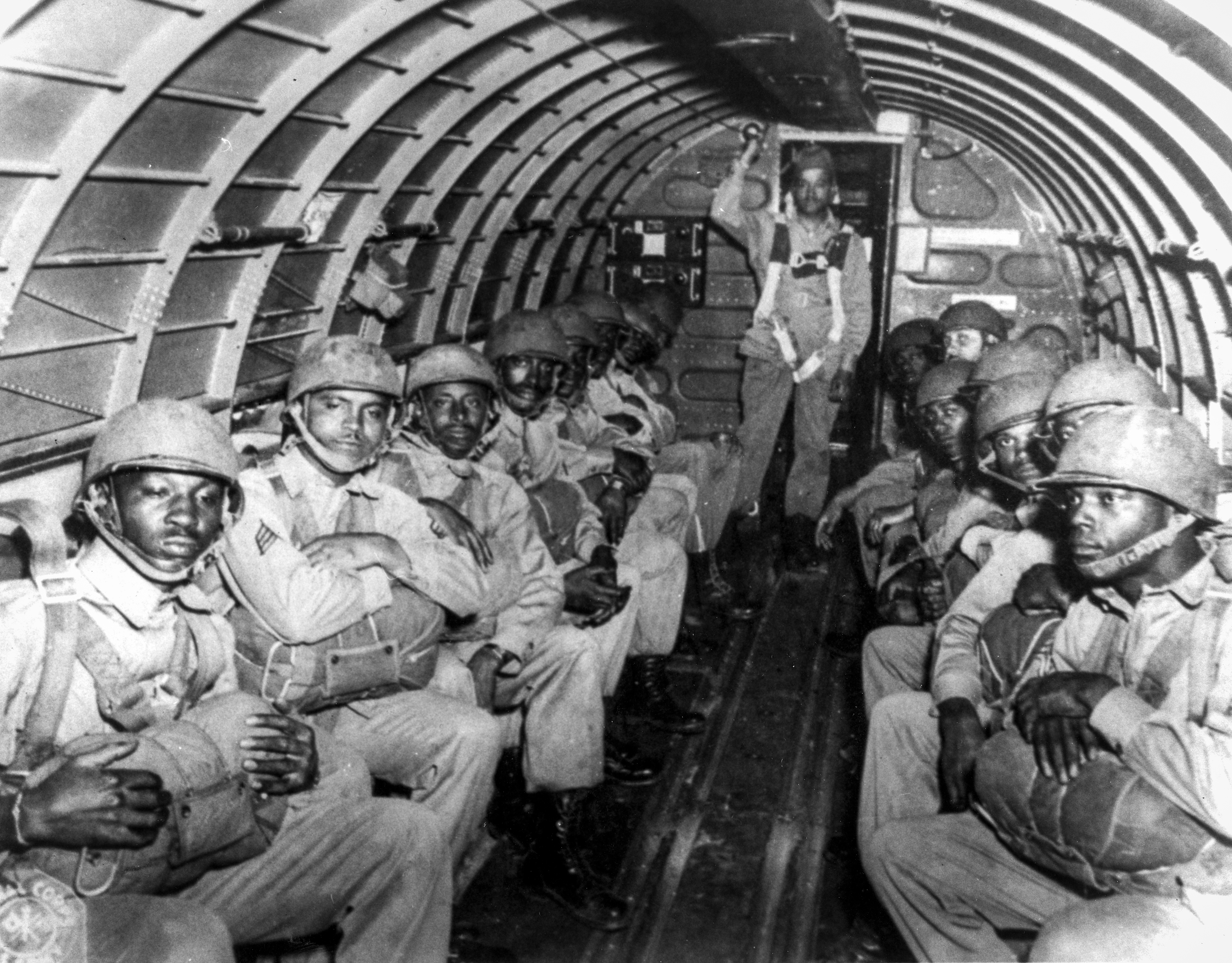 Triple Nickels wait to exit the aircraft.